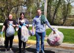 A group of people holding trash bags